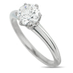 Platinum diamond solitaire ring front angled view with round center stone and prongs