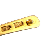 Gold-tone hinge bar stamped with '14K58' for clip earrings