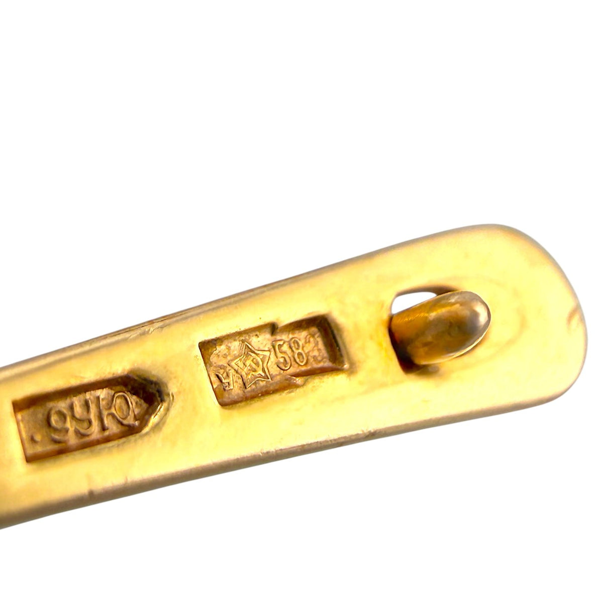 Gold-tone hinge bar stamped with '14K58' for clip earrings