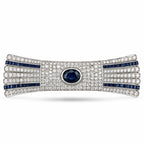 Art deco diamond and sapphire bow bar brooch with dark blue center stone and four blue bands