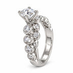 White gold diamond ring set with large center stone and round diamonds along the band