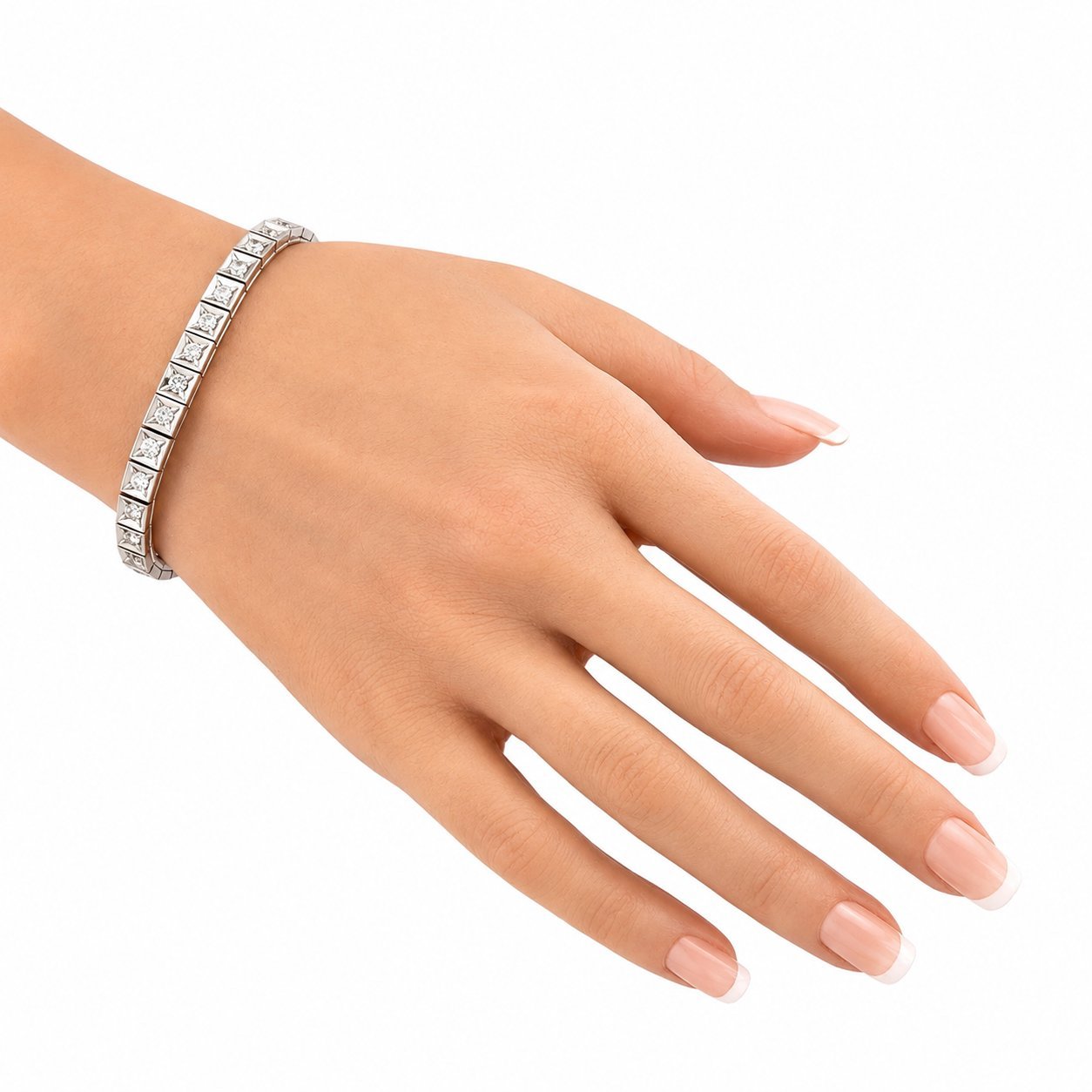Diamond tennis bracelet on wrist with round stones in rectangular settings
