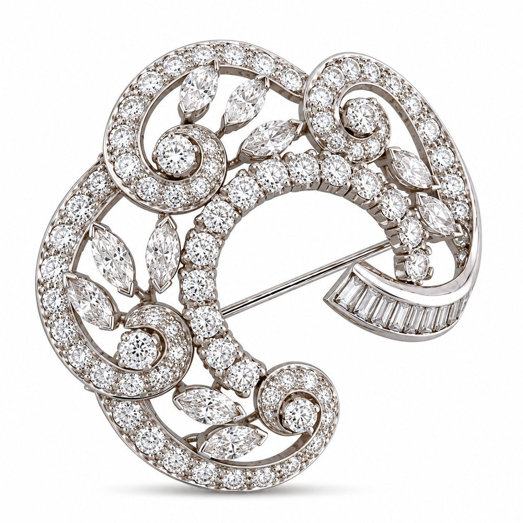 18K white gold diamond swirl brooch with round and baguette stones, curved setting.