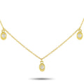 14K yellow gold station necklace with three round diamonds set in small discs