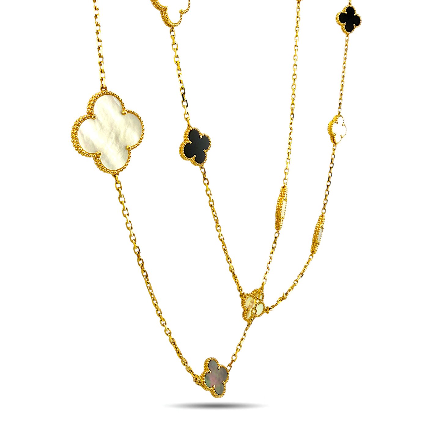 Gold long necklace close-up with clover charms and chain links, mother-of-pearl and onyx mix
