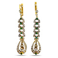 Gold dangle earrings with green emerald link stations and diamond accents, teardrop drops