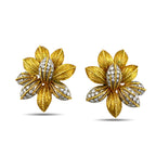 Pair of gold and diamond flower earrings, front view