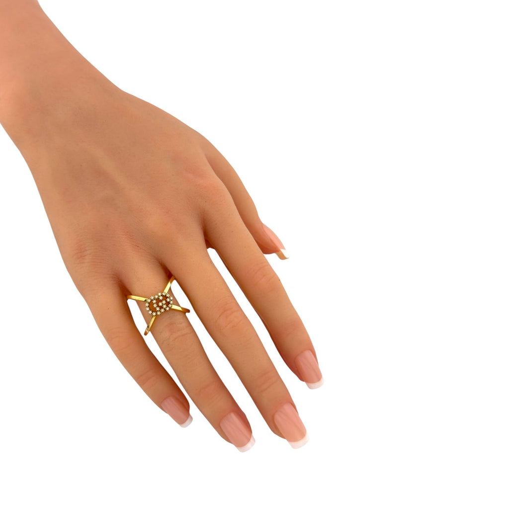 Gucci 18K yellow gold diamond ring on a hand