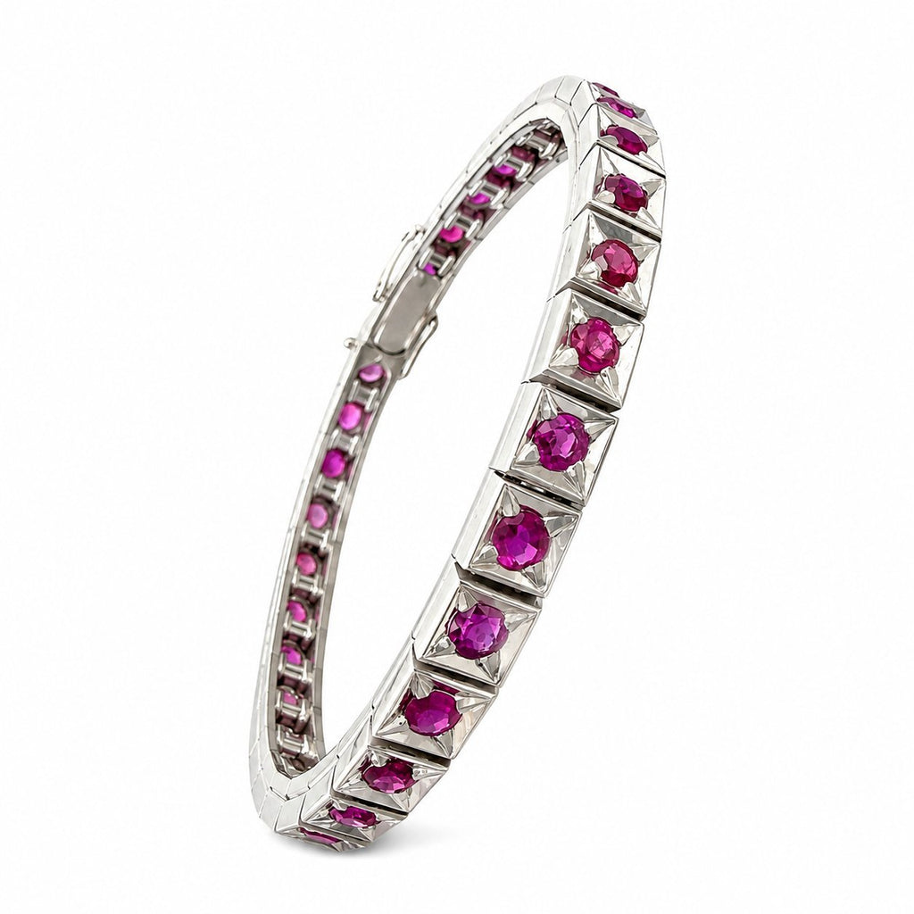 Platinum tennis bracelet profile with prong-set ruby stones in raised frames