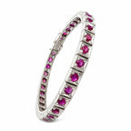 Platinum tennis bracelet profile with prong-set ruby stones in raised frames