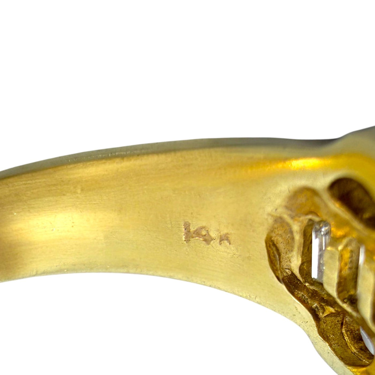 14K yellow gold ring band close-up with hallmark engraving