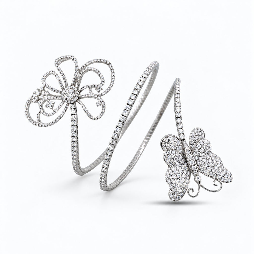 Flexible white gold diamond bracelet with openwork flower and butterfly motifs