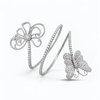 Flexible white gold diamond bracelet with openwork flower and butterfly motifs