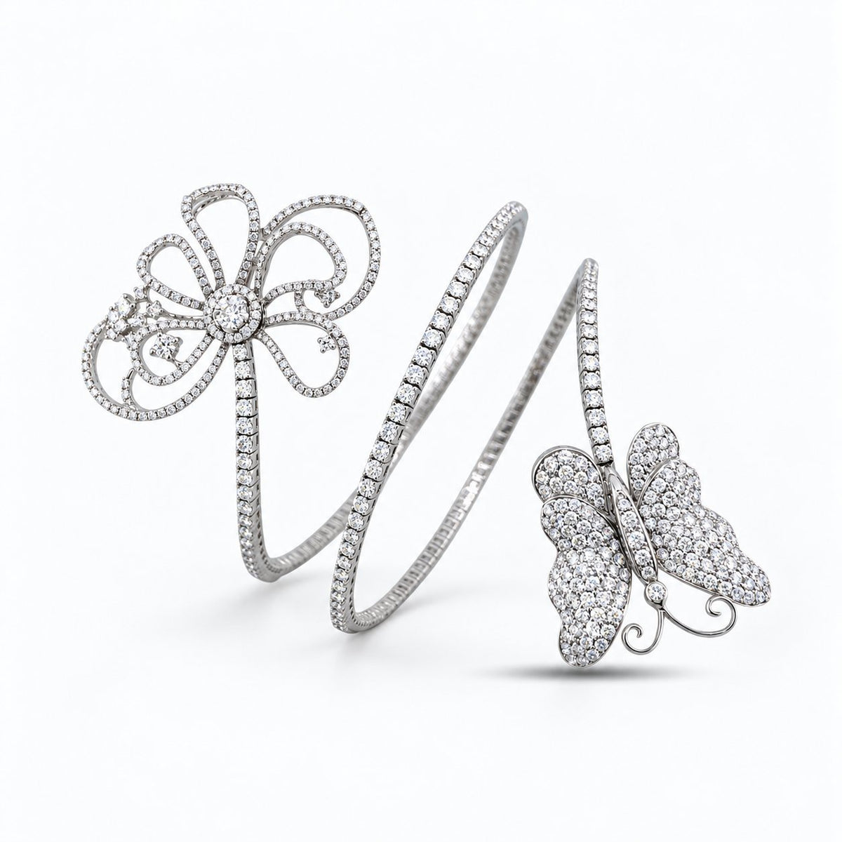 Flexible white gold diamond bracelet with openwork flower and butterfly motifs