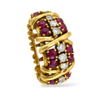 Vintage gold ring with ruby and diamond clusters, slight angled view