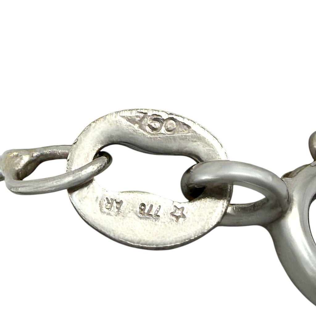 Silver clasp and hinge with hallmark engraving, back detail of heart gemstone necklace