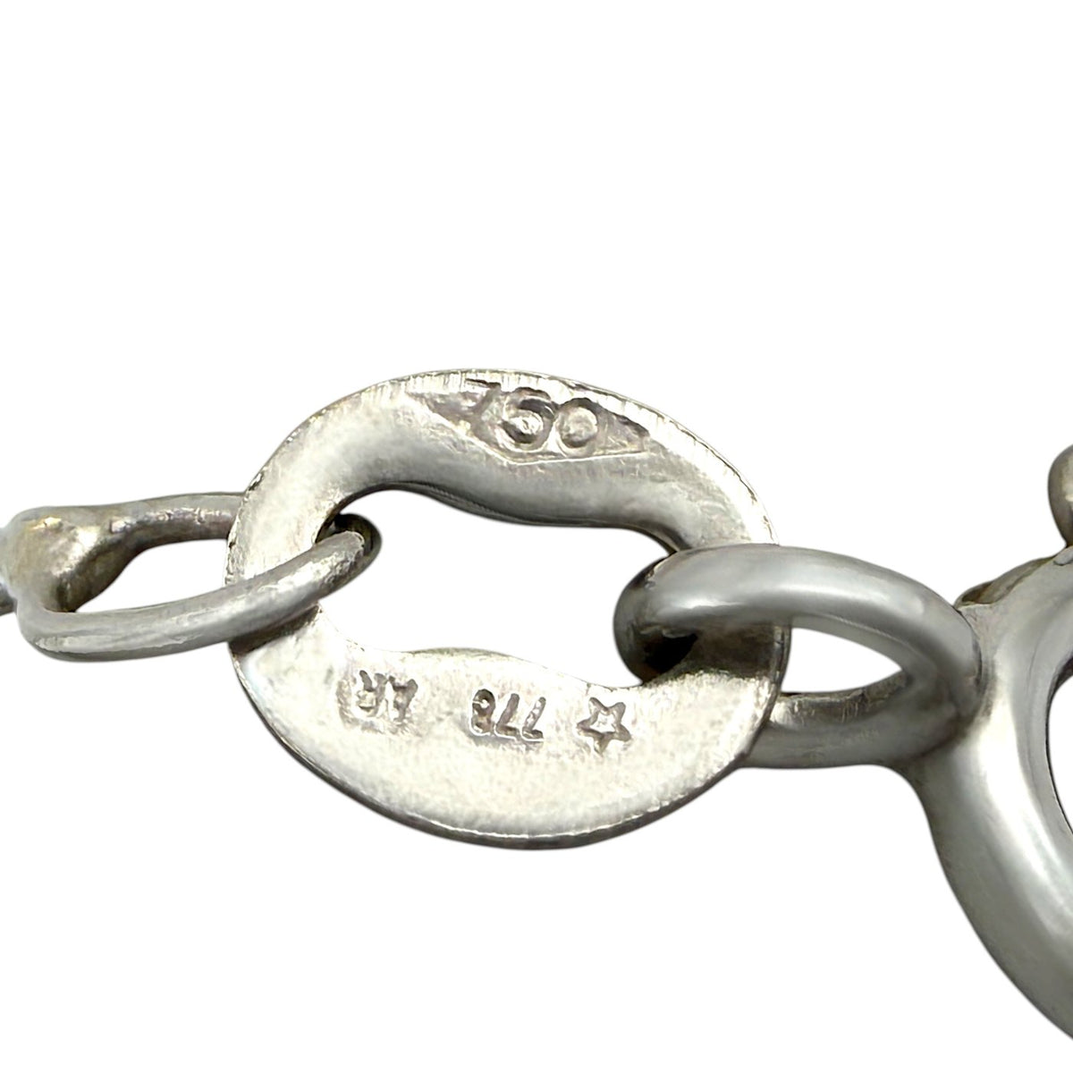 Silver clasp and hinge with hallmark engraving, back detail of heart gemstone necklace