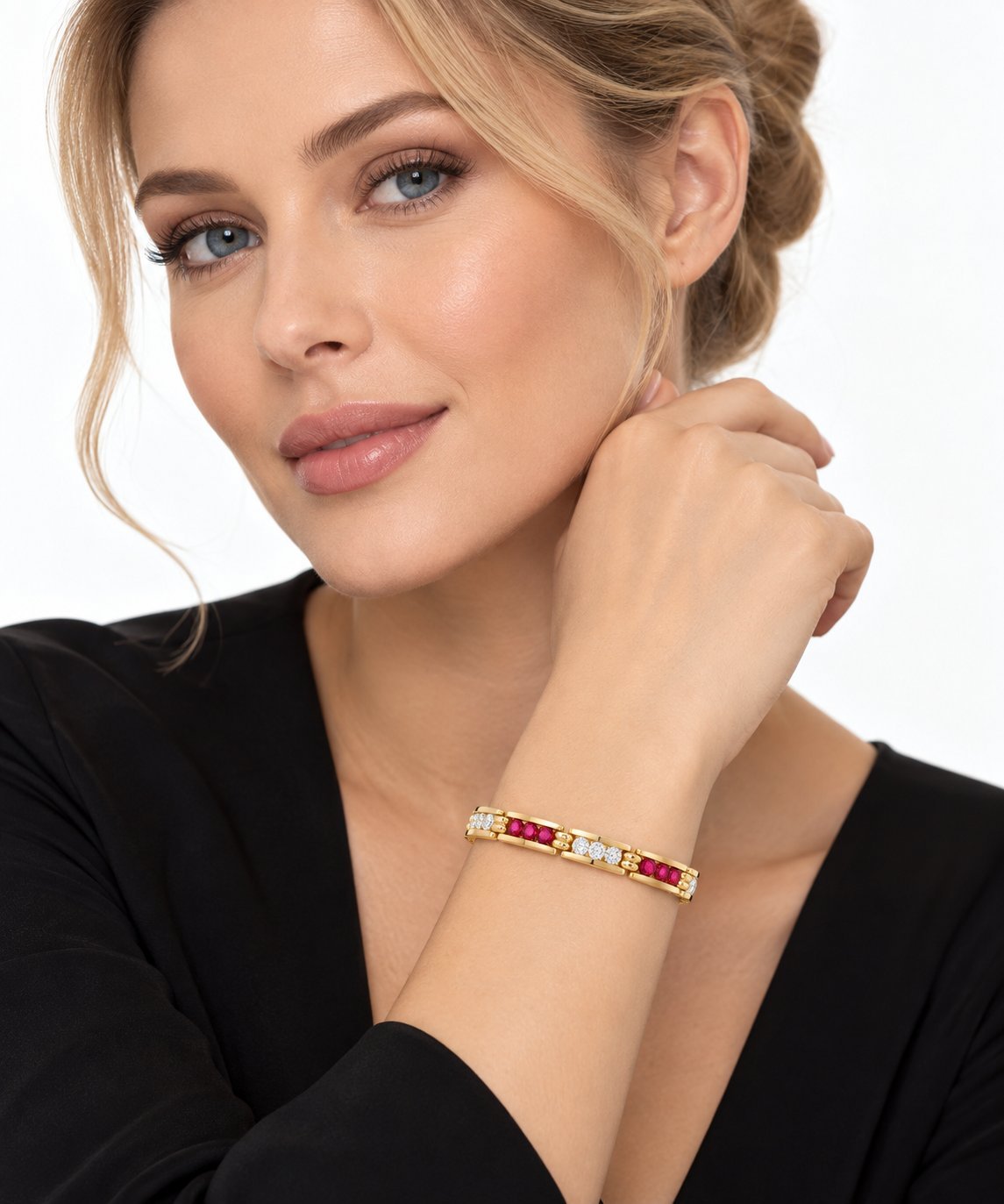 Yellow gold ruby and diamond bracelet on wrist, shown with model wearing it.