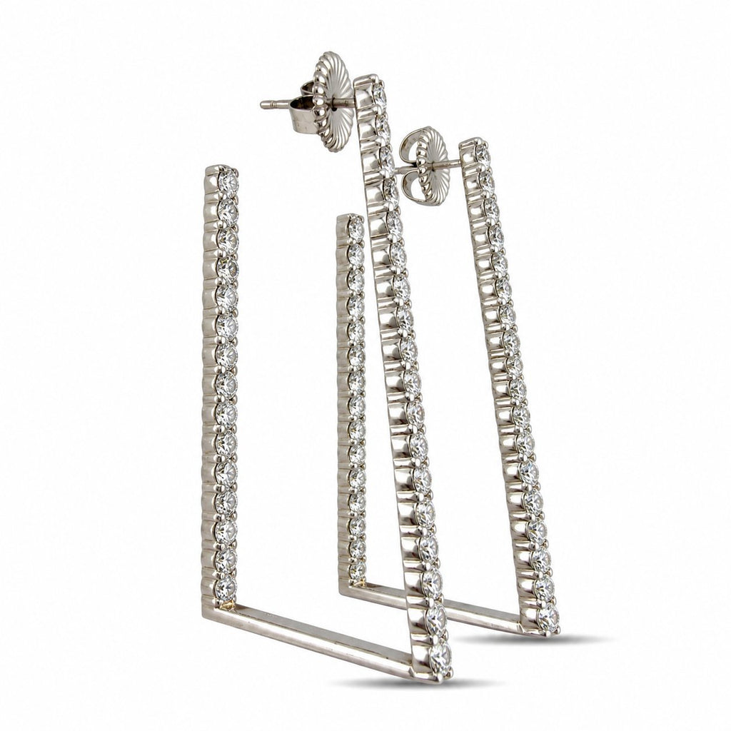 Platinum diamond drop earrings viewed from the back, showing the open frame and post backs