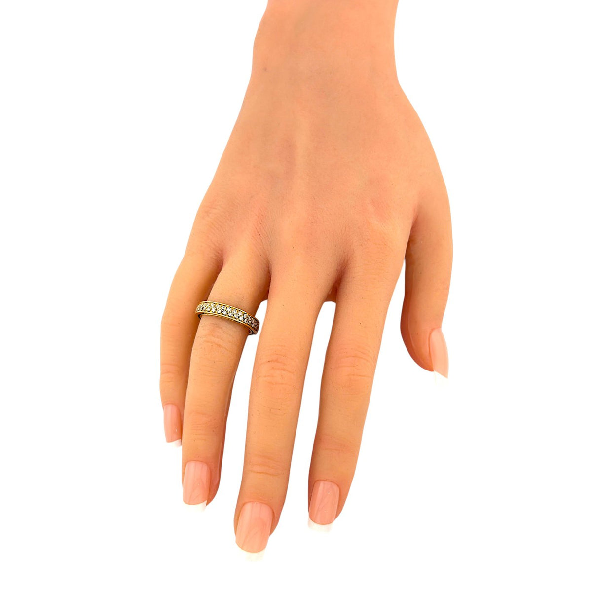 18K yellow gold diamond ring on open hand, slim band with row of round diamonds