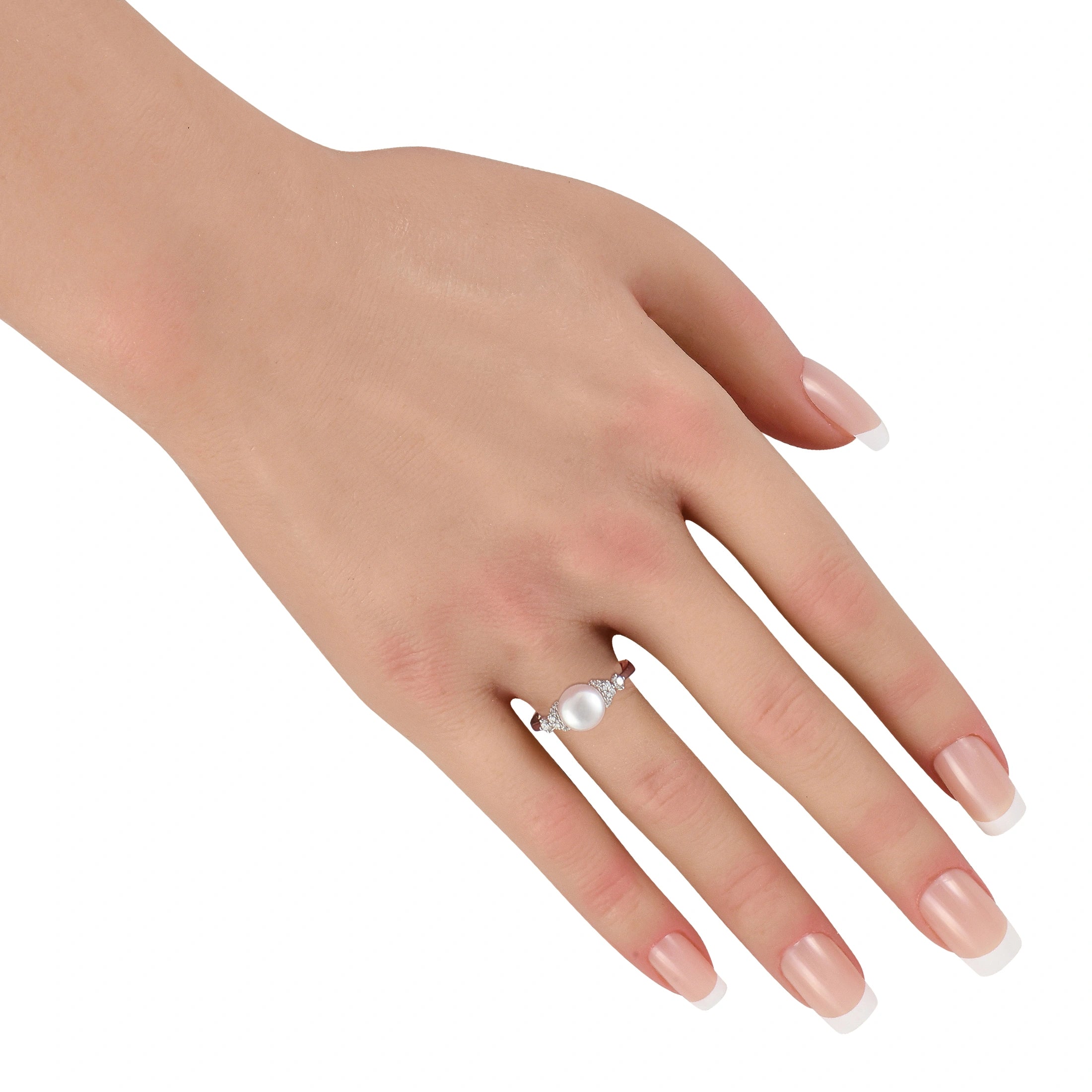 Assael pearl and diamond ring worn on hand with manicured nails