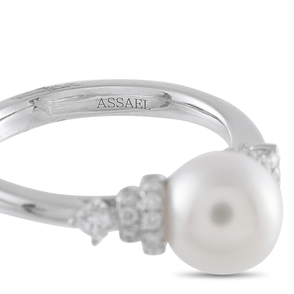 Assael ring close-up with engraved band and round white pearl