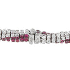 Close-up diamond and ruby snake bracelet segment with hinged clasp and alternating stone links