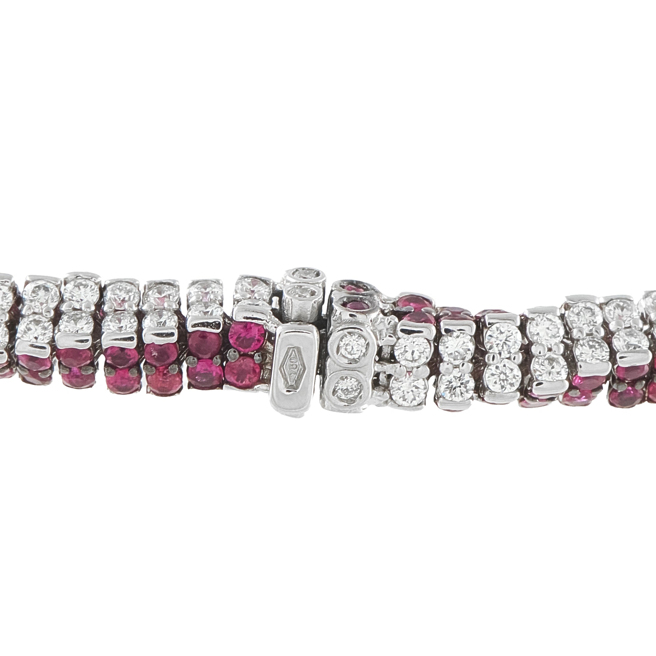 Close-up diamond and ruby snake bracelet segment with hinged clasp and alternating stone links