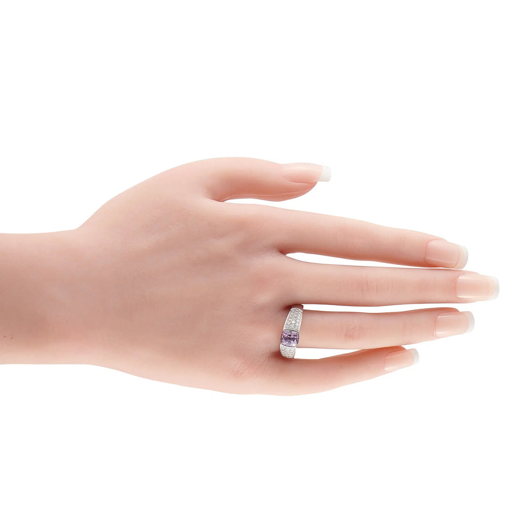 18K white gold diamond and pink sapphire ring worn on finger