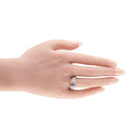 18K white gold diamond and pink sapphire ring worn on finger
