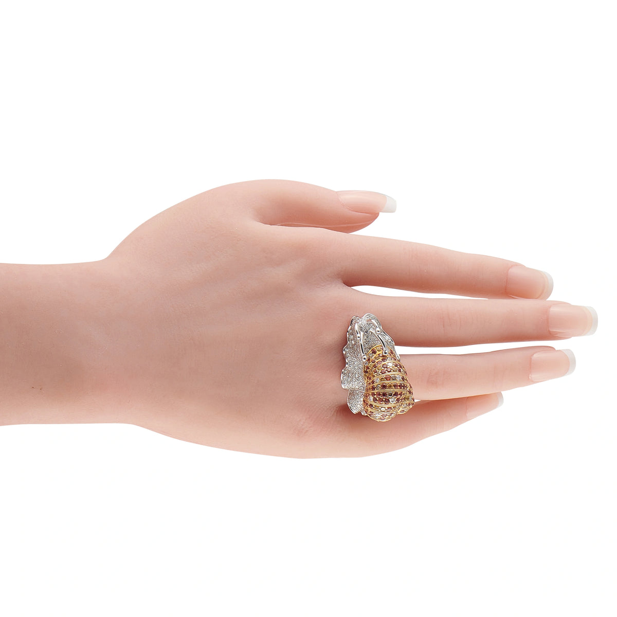 Boucheron white gold diamond and sapphire snail ring on a hand