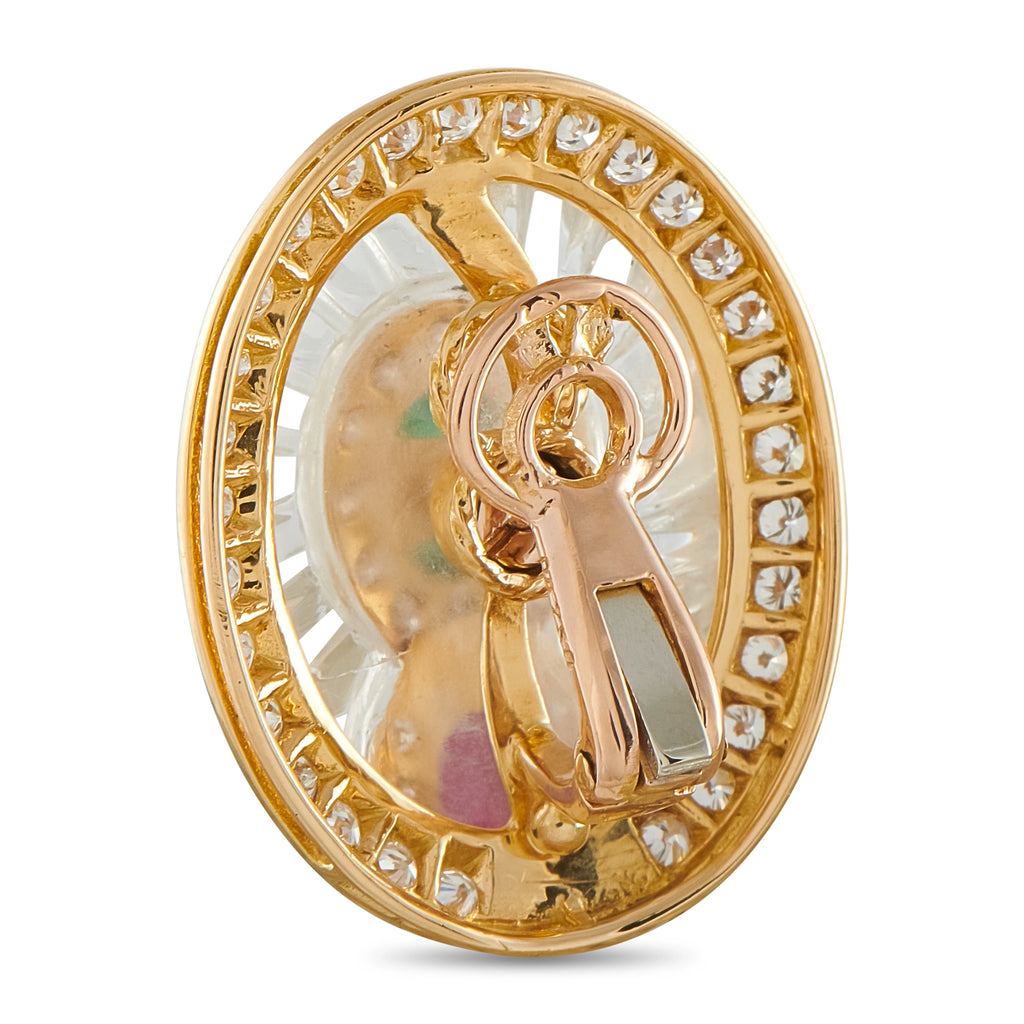 Oval clip earrings view from side: gold frame with diamond trim and gemstone center setting
