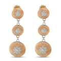 Rose gold drop earrings with three graduated textured discs and small star-shaped accents