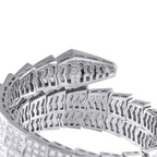 Close-up of white gold bracelet links with diamond-set panels and openwork backing.