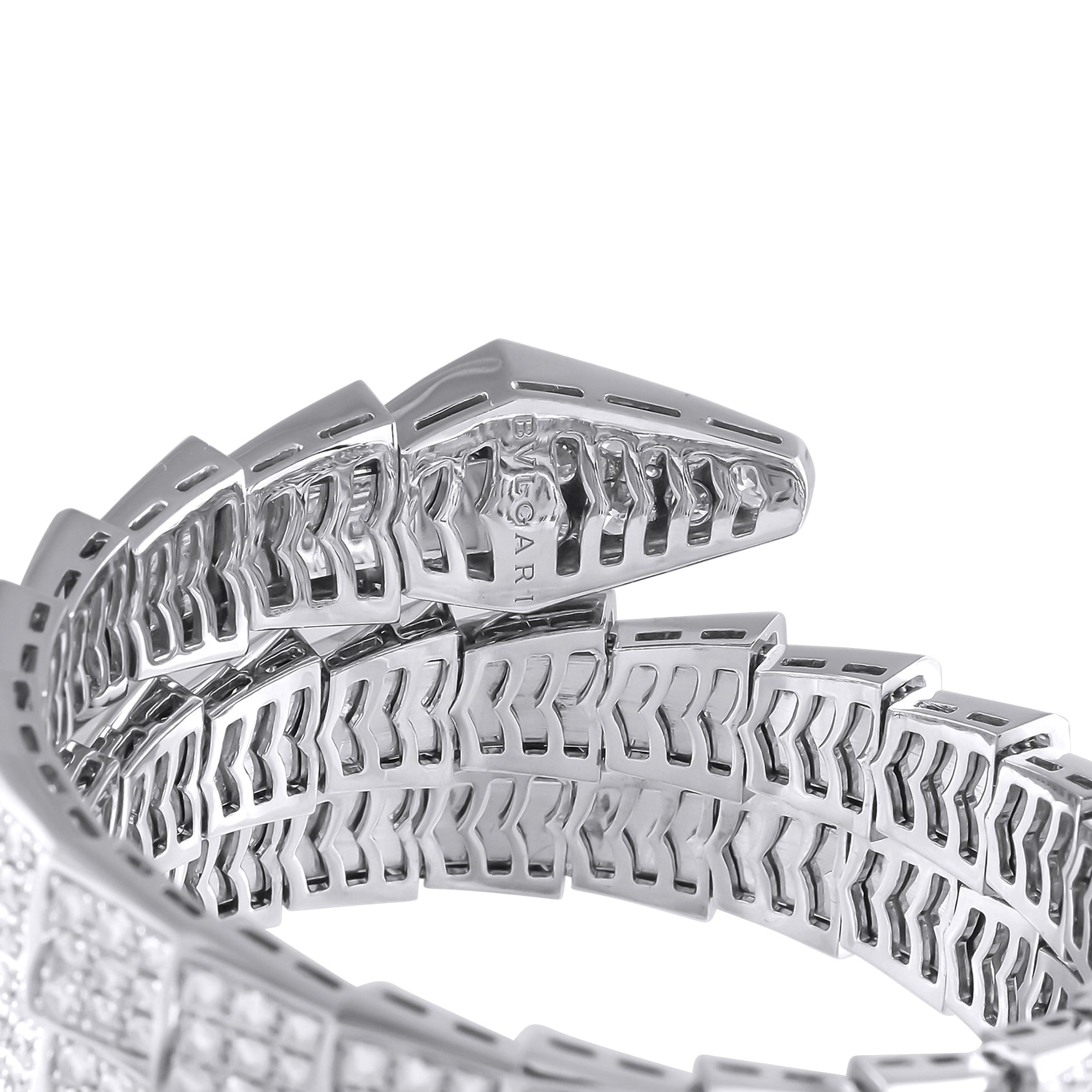Close-up of white gold bracelet links with diamond-set panels and openwork backing.