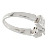 White gold diamond ring with prong-set round center and engraved band details