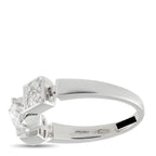 White gold diamond ring with round center stone and square side stones, side view