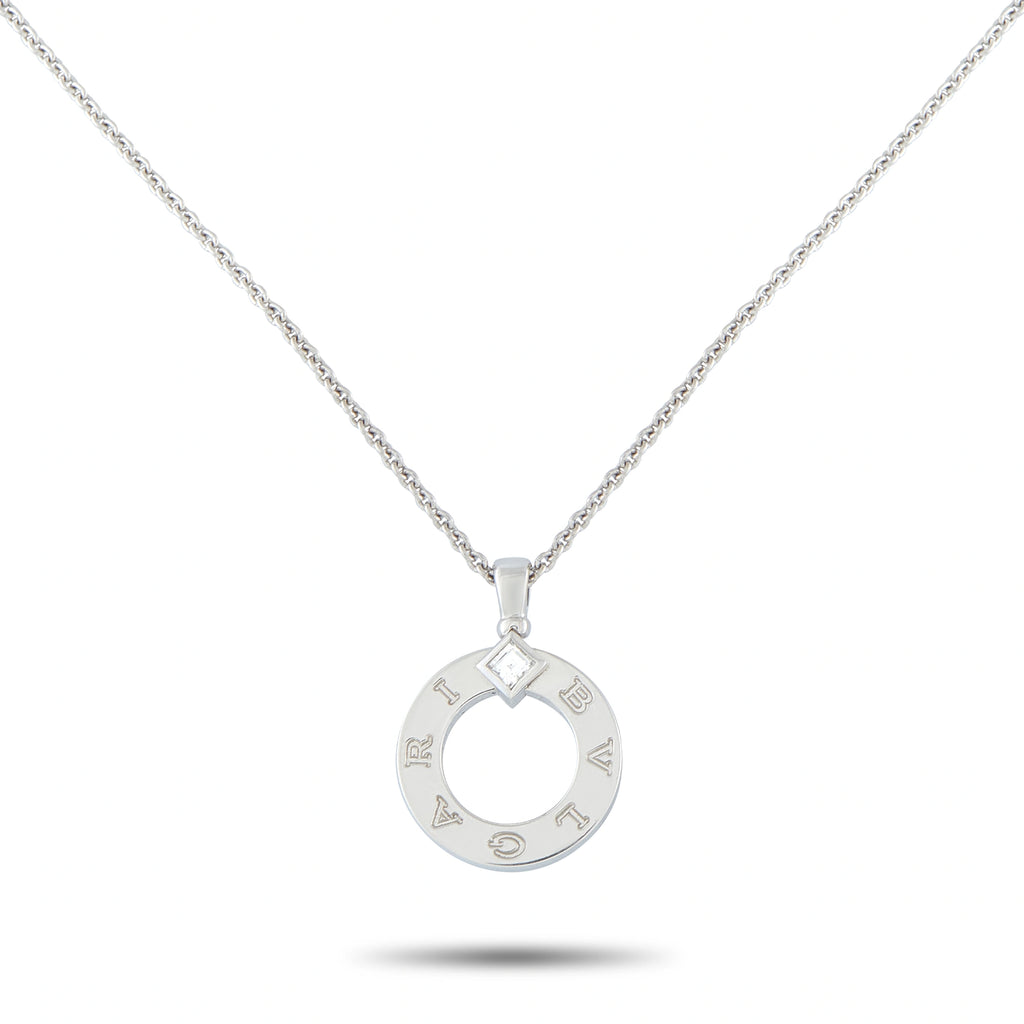 White gold circular diamond pendant with open ring design and logo engravings