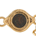 Yellow gold coin centerpiece bracelet with black engraved medallion and diamond inlays