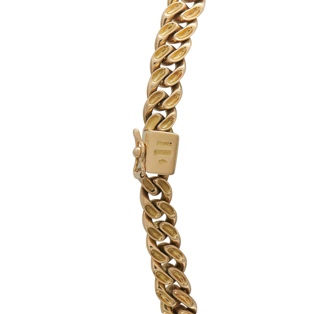 Gold tone link chain necklace with rectangular clasp tag and double-link curb chain