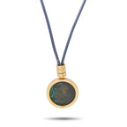 Gold coin pendant on blue cord necklace with engraved band clasp