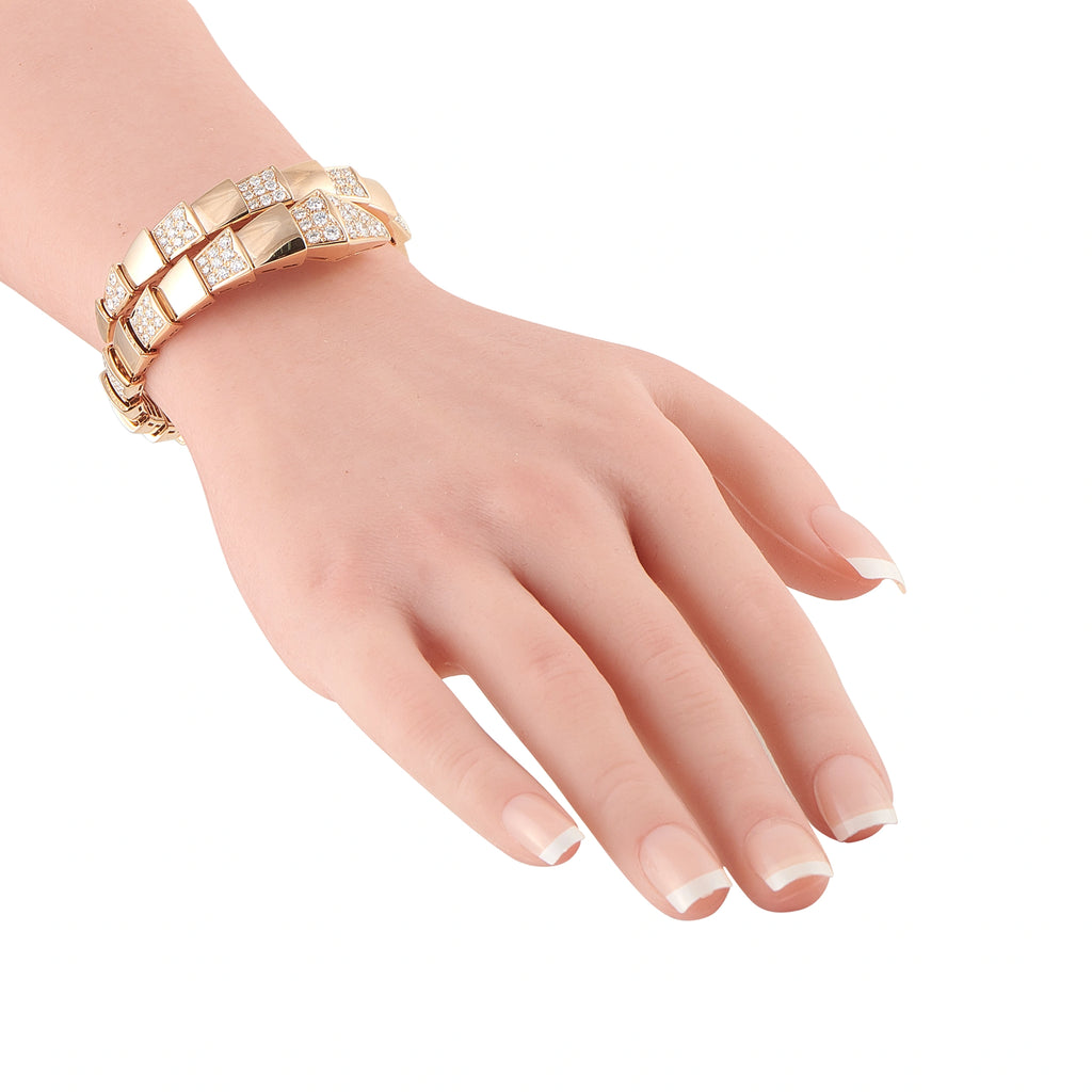 18K rose gold diamond bracelet on wrist with interlocking geometric link design