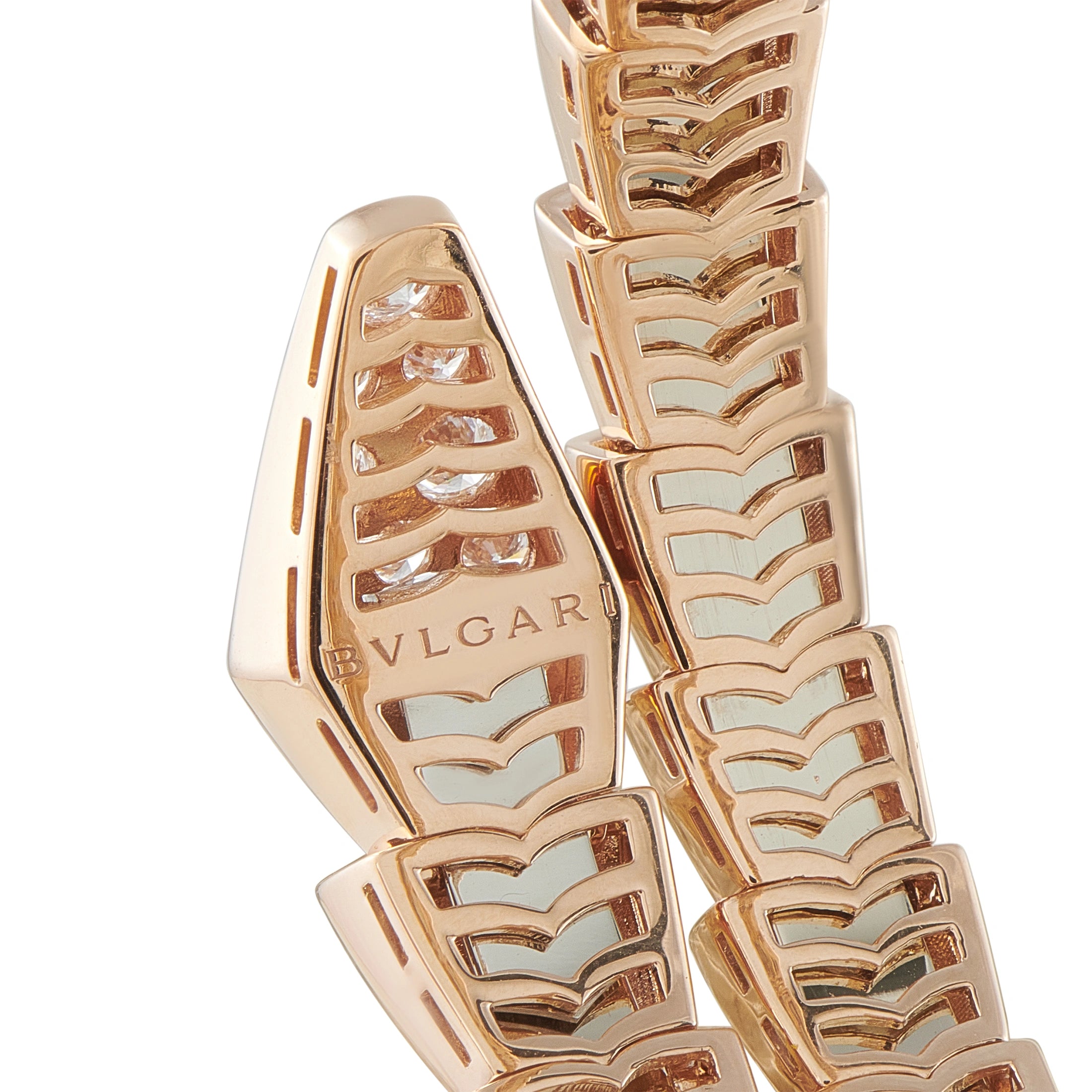 Bvlgari bracelet clasp close-up with engraved BVLGARI logo and scale-pattern links