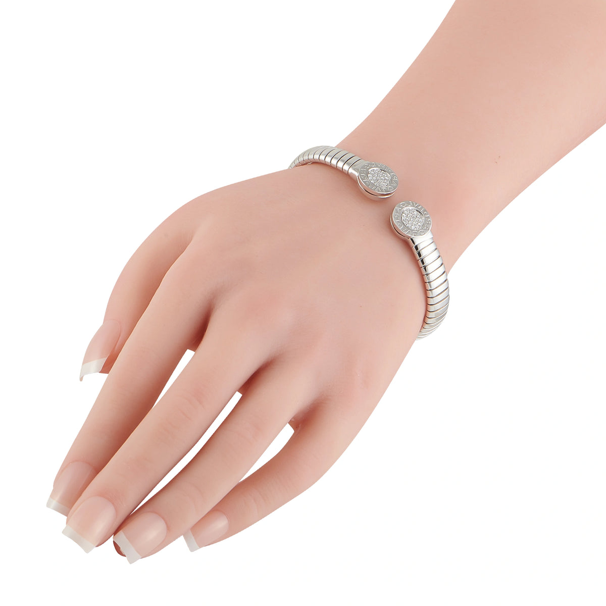 Bvlgari diamond tubogas bracelet on wrist, rounded stainless steel links