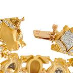 18K yellow gold frog bracelet clasp detail with clear diamond-set frog head motifs