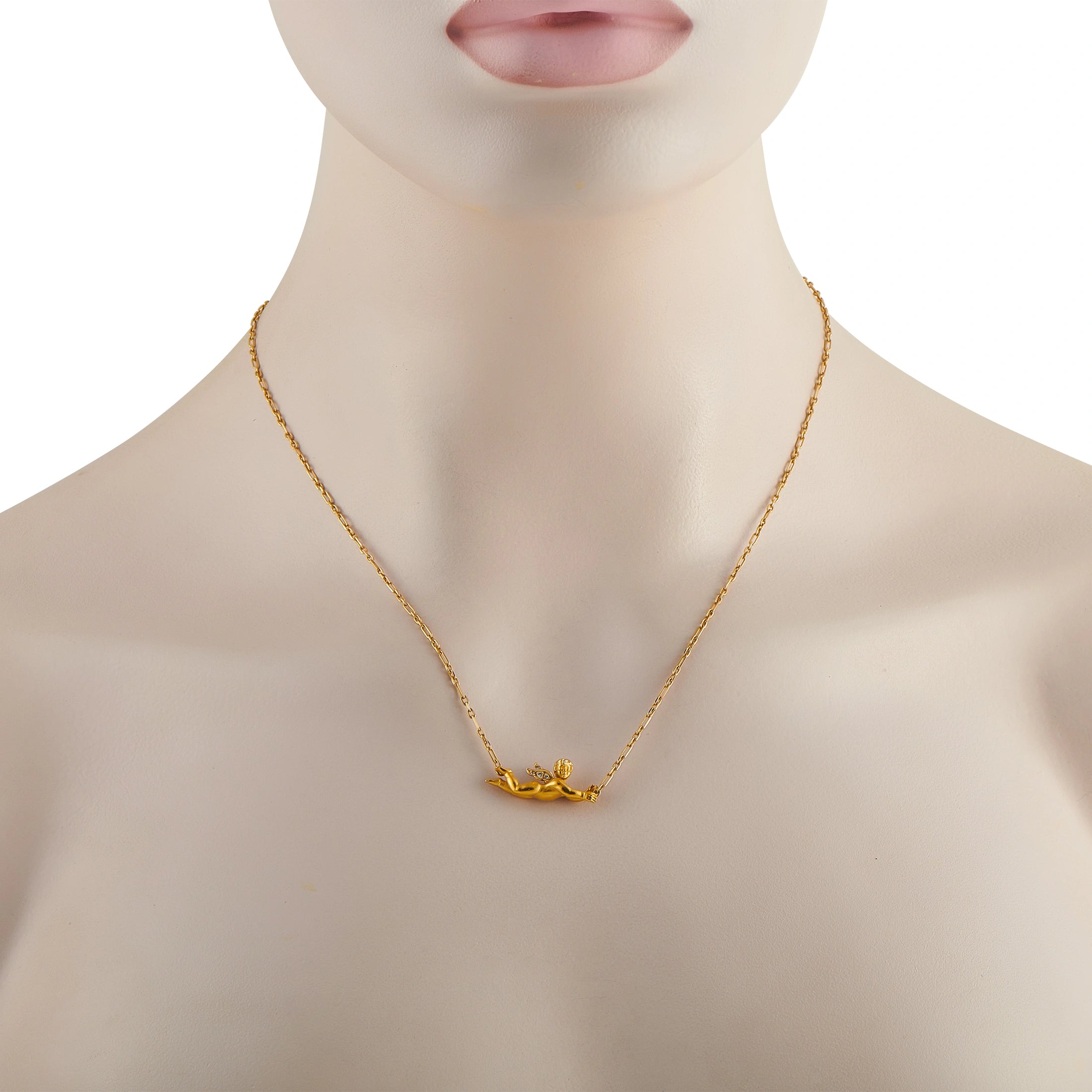Flying angel pendant necklace on model's neck, 18K yellow gold with small stones