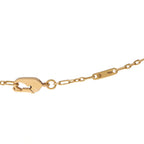 18K yellow gold necklace clasp detail with security ring and stamped markings