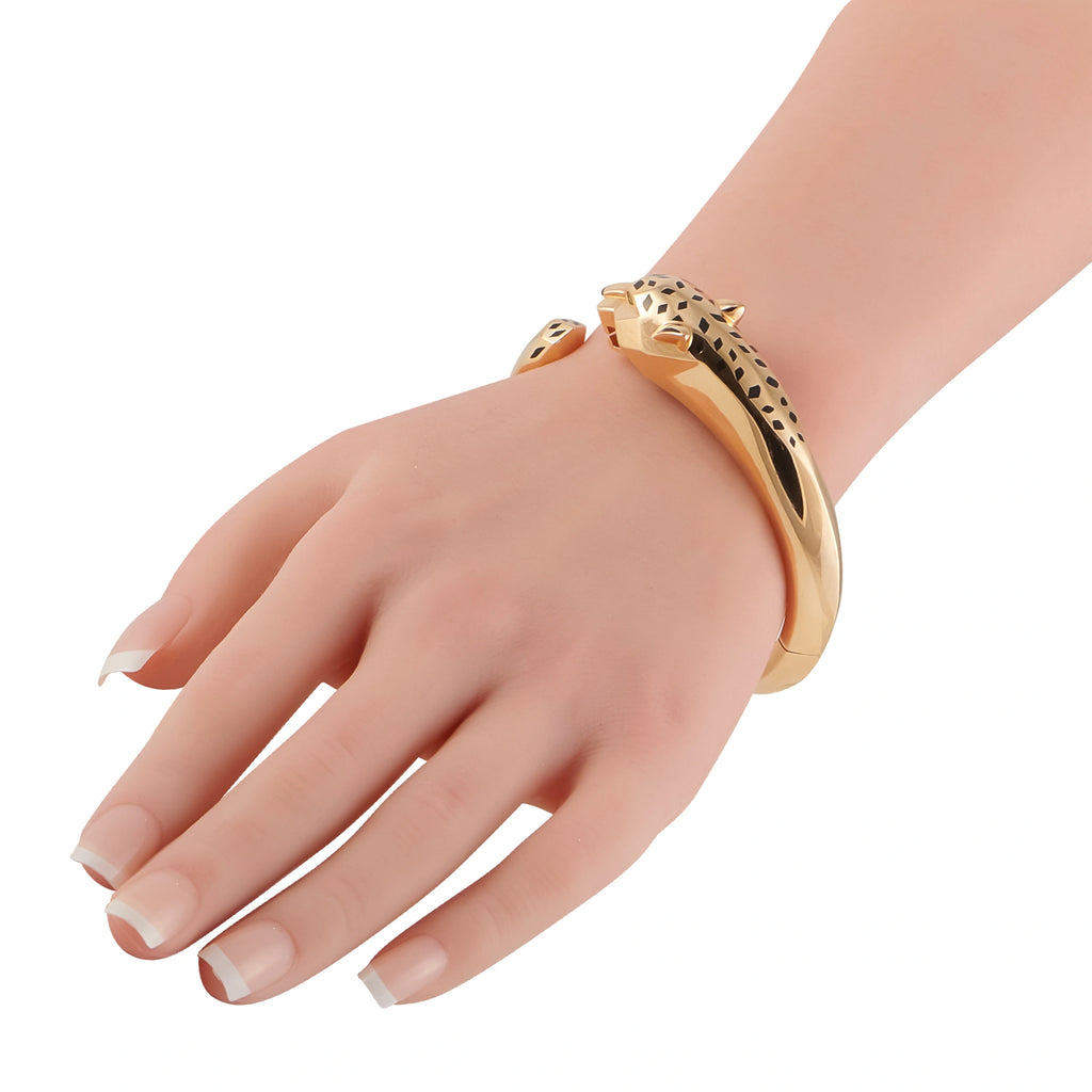 18K rose gold panther motif bracelet on wrist, black enamel detail