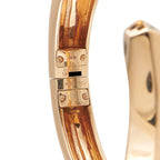 18K rose gold bracelet clasp with stamped markings, hinged mechanism