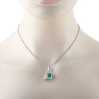 White gold chain with eagle-head pendant, green enamel and diamond pave detail